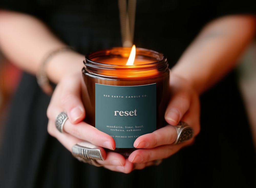 amber jar candle mockup in hands closeup 294